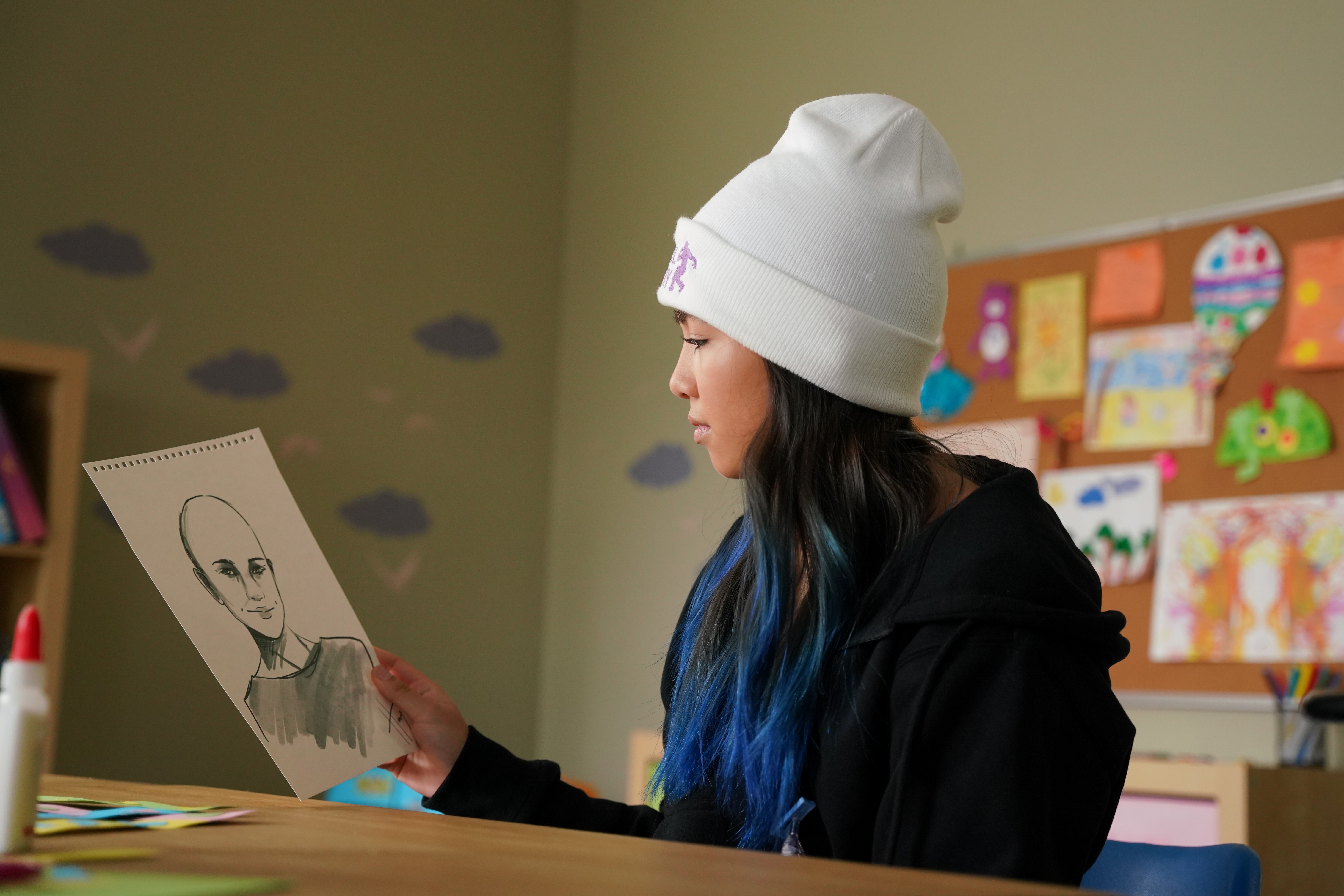 10. The_Unstoppable_Jenny_Garcia_episode 104-Jenny looking at a sketch of what she would look like without hair